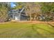 Guest house featuring a white garage door, and views of the main house at 5758 Chisolm Rd, Johns Island, SC 29455