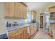 Well-lit kitchen featuring granite countertops, ample cabinet space, and modern appliances at 5758 Chisolm Rd, Johns Island, SC 29455