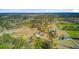 Wide aerial shot showcasing the home's location within a vast, wooded area at 614 Cummings Chapel Rd, Ridgeville, SC 29472