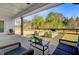 Inviting back porch with comfortable seating, overlooking a fenced-in yard with raised garden beds at 614 Cummings Chapel Rd, Ridgeville, SC 29472