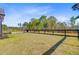Spacious backyard featuring a well-maintained lawn, garden, and a black fence defining the property line at 614 Cummings Chapel Rd, Ridgeville, SC 29472