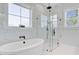 Modern bathroom featuring a glass enclosed shower and a relaxing soaking tub at 614 Cummings Chapel Rd, Ridgeville, SC 29472