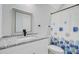 Beautiful bathroom featuring a granite countertop vanity with a patterned shower curtain at 614 Cummings Chapel Rd, Ridgeville, SC 29472