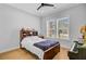 Bedroom with wood floors features a double window with natural light and ceiling fan at 614 Cummings Chapel Rd, Ridgeville, SC 29472