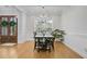 Elegant dining room featuring a chandelier, large window, and wainscoting at 614 Cummings Chapel Rd, Ridgeville, SC 29472