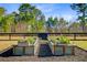 Close-up of raised garden beds with a variety of plants and flowers, surrounded by mulch at 614 Cummings Chapel Rd, Ridgeville, SC 29472