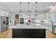 Modern kitchen with stainless steel appliances, a large island, and ample counter space at 614 Cummings Chapel Rd, Ridgeville, SC 29472