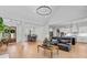 Open living space featuring hardwood floors and a view of the dining room and kitchen at 614 Cummings Chapel Rd, Ridgeville, SC 29472
