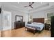 Bright main bedroom featuring tray ceilings, hardwood floors and lots of natural light at 614 Cummings Chapel Rd, Ridgeville, SC 29472