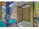 Rustic outdoor shower with wooden walls and a white shower base, adding a touch of nature at 614 Cummings Chapel Rd, Ridgeville, SC 29472