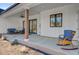 Covered patio featuring comfortable seating and a rocking chair at 614 Cummings Chapel Rd, Ridgeville, SC 29472