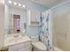 Cozy bathroom featuring blue walls and a vanity with a shower and tub at 628 Alwyn Blvd, Summerville, SC 29485
