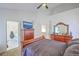 Large bedroom with stylish wood dresser and an open door to the bathroom at 628 Alwyn Blvd, Summerville, SC 29485