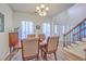 Cozy dining area with wood floors and view of the entryway at 628 Alwyn Blvd, Summerville, SC 29485