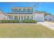 Charming two-story home with green shutters and a well-manicured lawn at 628 Alwyn Blvd, Summerville, SC 29485