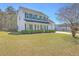 Two-story home with a lush green lawn and a long driveway at 628 Alwyn Blvd, Summerville, SC 29485