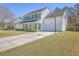 Two-story home with an attached garage and a basketball hoop at 628 Alwyn Blvd, Summerville, SC 29485