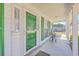 Charming front porch with a green door and space for seating at 628 Alwyn Blvd, Summerville, SC 29485