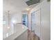 Bright hallway showcasing wood floors leading to bedrooms and white trim at 628 Alwyn Blvd, Summerville, SC 29485