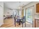 Open kitchen and dining area leading to backyard, complete with a ceiling fan at 628 Alwyn Blvd, Summerville, SC 29485