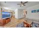 Open living space with hardwood floors, a comfortable couch, and an eat in kitchen at 628 Alwyn Blvd, Summerville, SC 29485