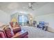 Cozy living room with vaulted ceiling, plush carpet, and comfortable leather seating at 628 Alwyn Blvd, Summerville, SC 29485
