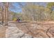 A playground with slides and swings is nestled in a wooded area with walking path for residents enjoyment at 628 Alwyn Blvd, Summerville, SC 29485