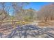 Scenic view of the property's picturesque pond and a rustic fence at 628 Alwyn Blvd, Summerville, SC 29485