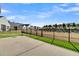 Private backyard with concrete patio, surrounded by fence and well-manicured lawn at 663 Marsh Cove Cir, Summerville, SC 29486