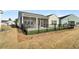 Fenced backyard with green space and outdoor living space at 663 Marsh Cove Cir, Summerville, SC 29486