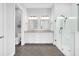 Modern bathroom with dual vanity, large shower, and neutral tile flooring at 663 Marsh Cove Cir, Summerville, SC 29486