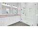 Well-lit bathroom with dual vanity, tiled shower, and clean, modern finishes at 663 Marsh Cove Cir, Summerville, SC 29486