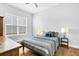 Bright bedroom featuring a comfortable bed with stylish bedding and hardwood flooring at 663 Marsh Cove Cir, Summerville, SC 29486