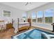 Bright bedroom with wood floors, large windows, and a ceiling fan at 663 Marsh Cove Cir, Summerville, SC 29486