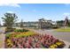 Community entrance with beautiful landscaping and clear signage, 'Models Open' at 663 Marsh Cove Cir, Summerville, SC 29486