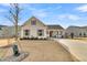 Charming single-story home featuring a welcoming front porch and a well-maintained lawn at 663 Marsh Cove Cir, Summerville, SC 29486