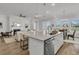 Open concept kitchen with island, stainless steel appliances and living room view at 663 Marsh Cove Cir, Summerville, SC 29486