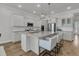 Modern kitchen with stainless steel appliances, a large island, and seating for four at 663 Marsh Cove Cir, Summerville, SC 29486