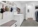 Charming mudroom with bench, storage, and convenient access to the laundry room at 663 Marsh Cove Cir, Summerville, SC 29486
