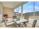 Relaxing screened patio with furniture, ideal for outdoor enjoyment at 663 Marsh Cove Cir, Summerville, SC 29486