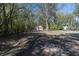 The expansive backyard features an outbuilding and views of the home at 708 S Laurel St, Summerville, SC 29483