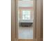 Bathroom featuring a clawfoot tub, wood-look tile, and view to the exterior at 708 S Laurel St, Summerville, SC 29483