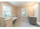 This bathroom features clawfoot tub, walk-in shower, and updated vanity at 708 S Laurel St, Summerville, SC 29483
