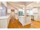 Modern kitchen featuring white cabinets, stainless steel appliances, stone countertops and an open layout great for entertaining at 708 S Laurel St, Summerville, SC 29483
