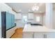Modern kitchen with white cabinets, stainless steel appliances, and a large center island for efficient food preparation at 708 S Laurel St, Summerville, SC 29483