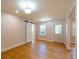 Bright living room with hardwood floors, complemented by a stylish sliding barn door and natural light from multiple windows at 708 S Laurel St, Summerville, SC 29483