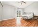 Bedroom with wood-look flooring, vaulted ceiling, and large sliding glass door to balcony at 7814 Nummie Ct, North Charleston, SC 29418