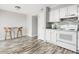 Bright kitchen with an eat in nook, mosaic backspash, and wood-look flooring at 7814 Nummie Ct, North Charleston, SC 29418