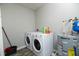 Functional laundry room with updated washer, dryer, and water heater at 7814 Nummie Ct, North Charleston, SC 29418