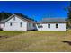 Rear view of a cozy home with a well-kept lawn at 8524 Cane Branch Rd, Ruffin, SC 29475